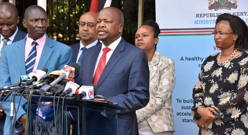 Health CS Mutahi Kagwe flanked by other government officials at a recent Covid-19 press conference