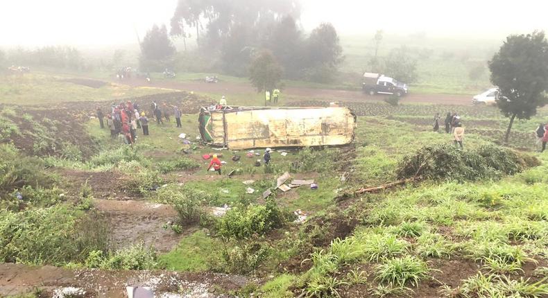 Mbukinya bus full of passengers rolls off the Kinungi black spo