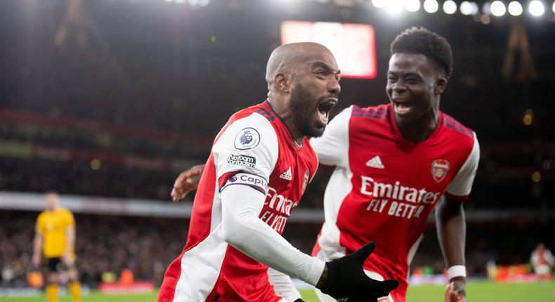 Alexandre Lacazette celebrates the stoppage time winner over Wolves