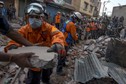 Nepalese military personnel remove debris in search of survivors after a fresh 7.3 earthquake struck, in Kathmandu