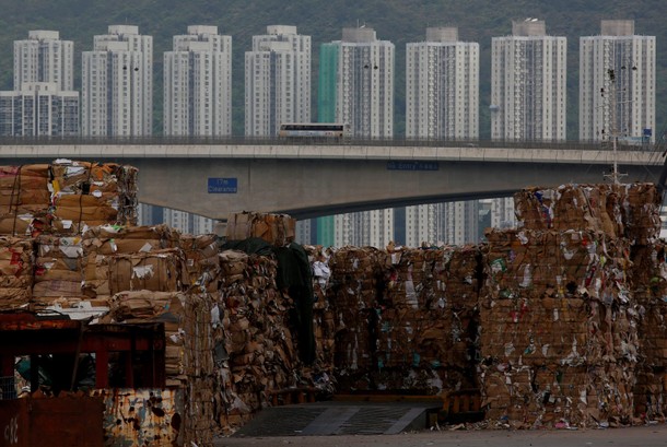 Tonnes of waste paper to be shipped to mainland China are piled up at a dock in Hong Kong