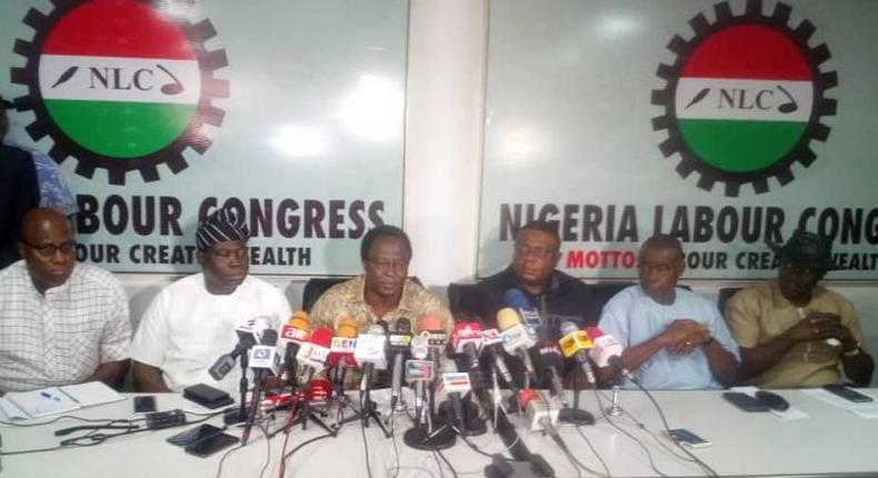 NLC President Ayuba Wabba (M) addressing a world press conference