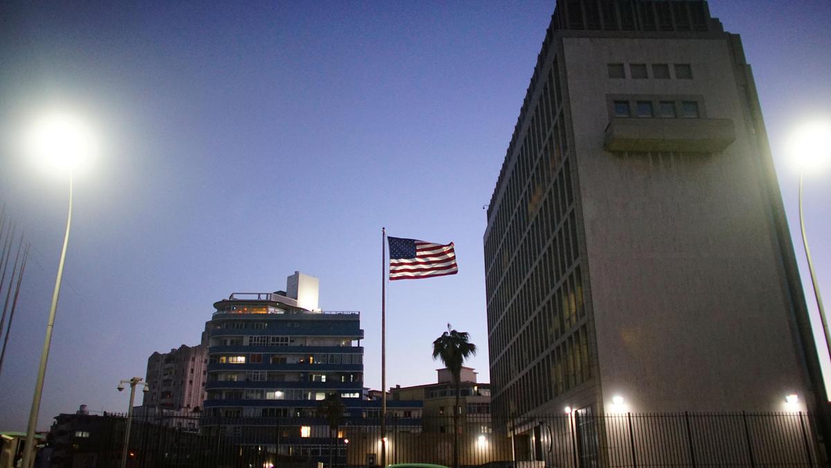 FILE PHOTO: A vintage car passes by in front of the U.S. Embassy in Havana, Cuba