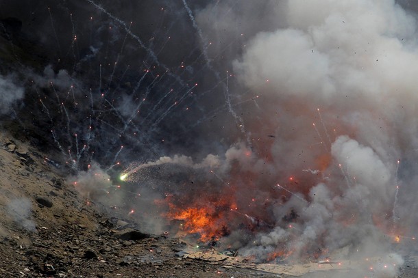 Fireworks confiscated from illegal vendors before New Year holidays are destroyed by police, in Lima