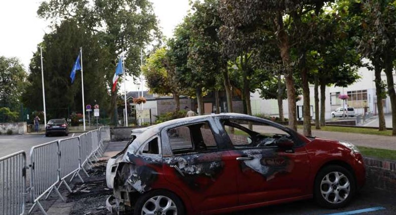 Cars burned north of Paris in 3rd night of tension over death in police hands