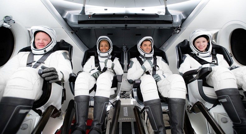 The Inspiration4 crew inside a model Crew Dragon spaceship. Left to right: Chris Sembroski, Sian Proctor, Jared Isaacman, and Hayley Arceneaux.
