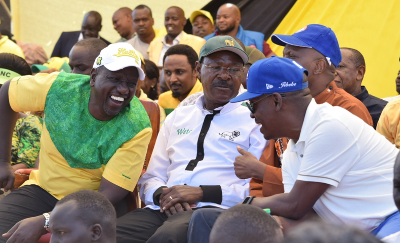 [FILE] Dr William Ruto in conversation with Kenya Kwanza principal Moses Wetangula, Chama Cha Kazi party leader Moses Kuria and Tujibebe Wakenya party leader William Kabogo during a rally at Thika Stadium, Kiambu County