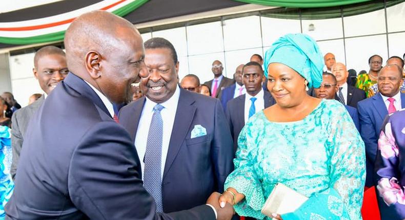 File image of President William Ruto greeting Musalia Mudavadi 's wife Tessie during the Mashujaa Day celebrations at Uhuru Gardens
