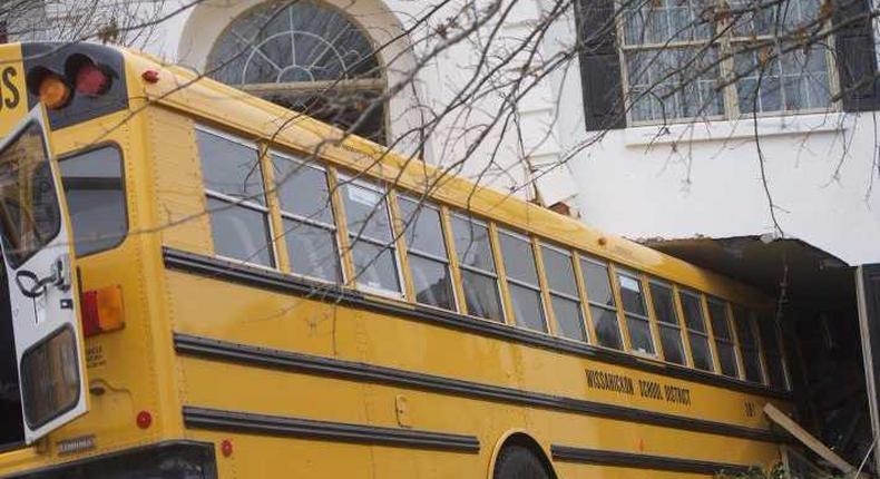 A school bus is pictured after it crashed into a house at the Windermere Development in Blue Bell, Pennsylvania.