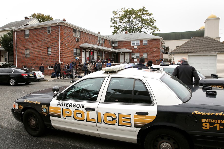 Police are pictured in front of what according to local media is the apartment of Sayfullo Saipov, the suspect in the New York City truck attack in Paterson, New Jersey on November 1, 2017.