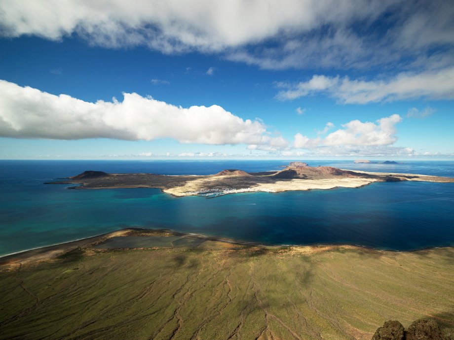 Graciosa Island (or La Graciosa), one of Spain's Canary Islands, is where you go if you're in search of stunning nature and solitary beaches. The island has a village where whitewashed houses and sandy lanes wait to be explored. The island also offers great opportunities for scuba diving.