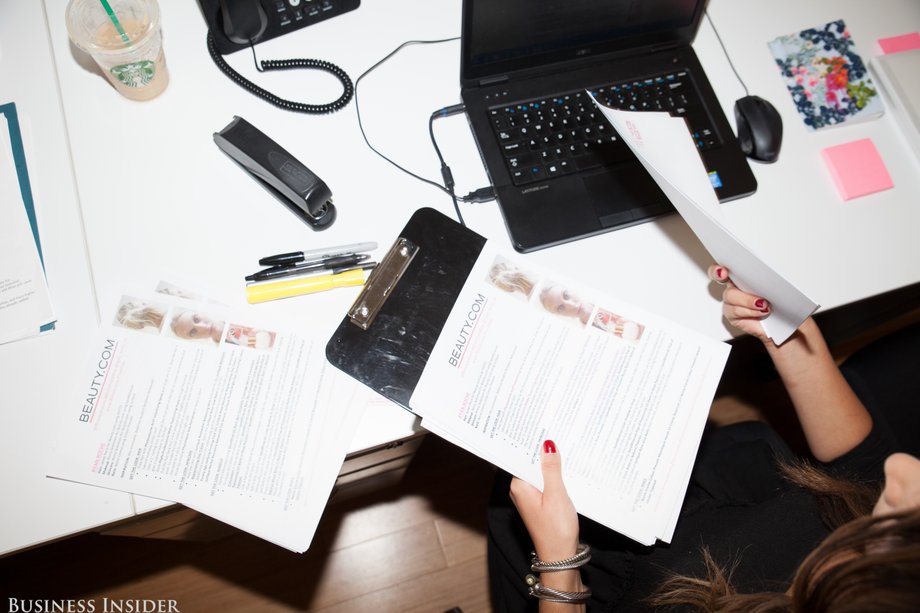 Oliva's first task of the day is to proofread and print the RSVP list and media handouts for the Ryan Roche runway show, which Brod's client, Beauty.com, is doing the backstage beauty for.