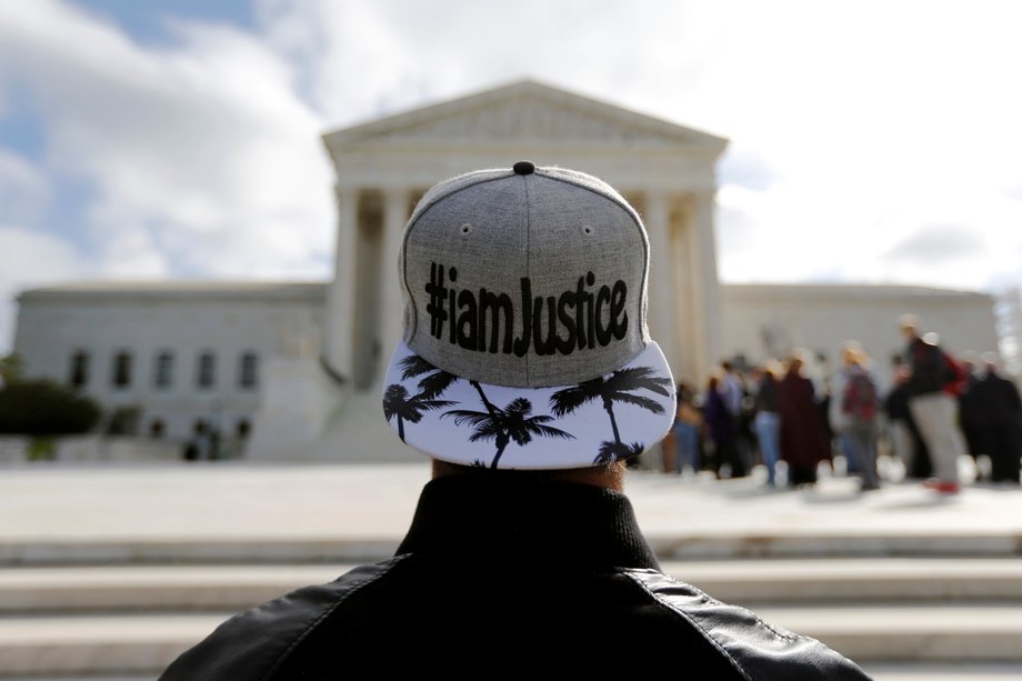 An antiabortion protester demonstrates outside the US Supreme Court building on the first day of the court's new term in Washington, October 5, 2015.