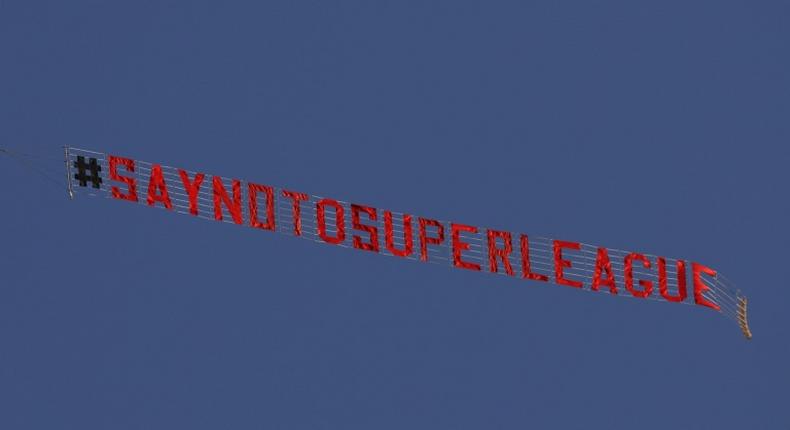 A plane flies above  Elland Road in Leeds before the Premier League game against Liverpool protesting against the planned Super League