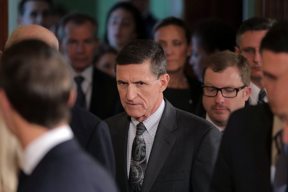 White House National Security Advisor Michael Flynn, center, arrives at the White House in Washington, February 13, 2017.