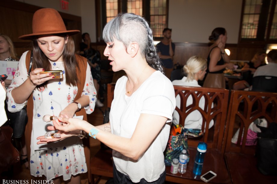 Alison Brod publicists help facilitate interviews between the media and backstage talent (like manicurist Nonie Creme, pictured below on the right). Oliva helped make sure every writer received a handout that explained the beauty look and detailed the products and techniques used.