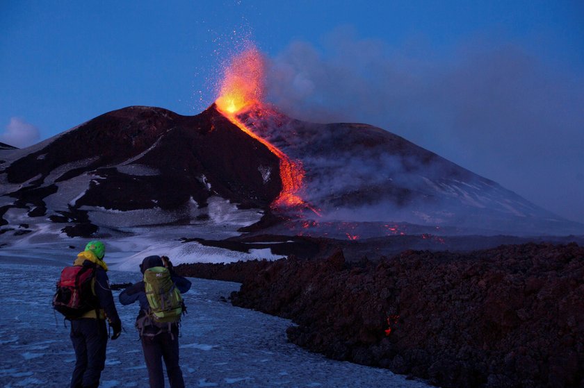 FILE PHOTO: Italy's Mount Etna, Europe's tallest and most active volcano, spews lava as it erupts on