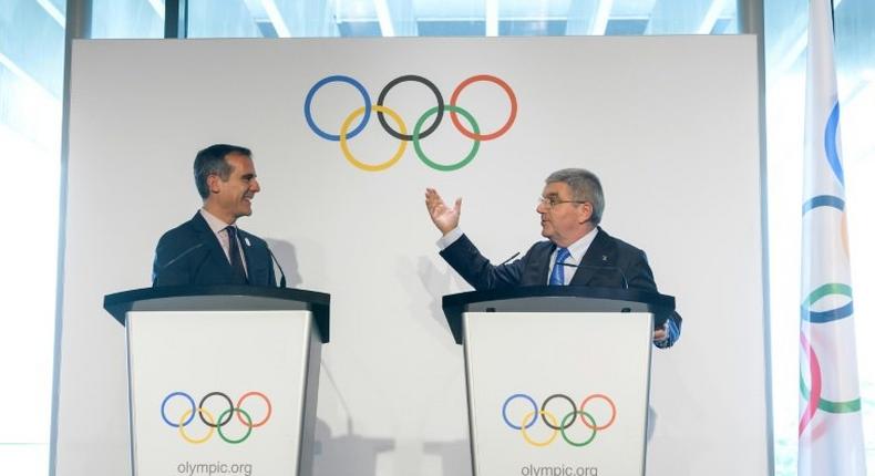 Los Angeles Mayor Eric Garcetti (L) and International Olympic Committee President Germany's Thomas Bach speak during their visit to the Olympic Museum in Lausanne on July 10, 2017