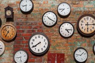 Hand with an old clock. Retro pocket watch