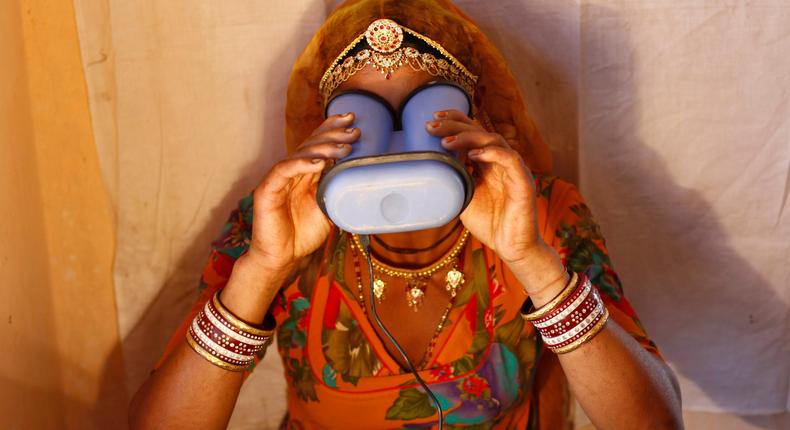 A villager goes through the process of eye scanning for Unique Identification (UID) database system in India.