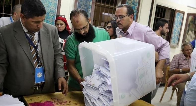 Employees count ballots after polls closed in the first phase of parliamentary elections at a voting center in Dokki, Giza governorate, Egypt, October 19, 2015. REUTERS/Asmaa Waguih