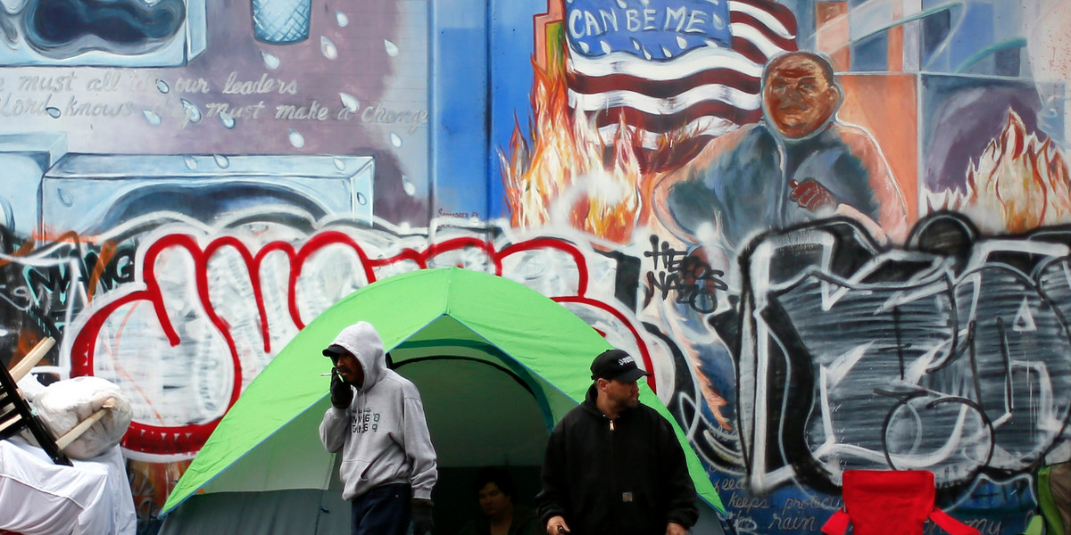 People wake up on downtown Los Angeles' Skid Row.
