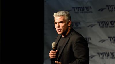 Yair Lapid, leader of 'Yesh Atid' Party and former Israeli Finance Minister speaks to supporters in 