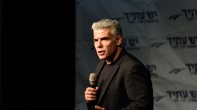 Yair Lapid, leader of 'Yesh Atid' Party and former Israeli Finance Minister speaks to supporters in 