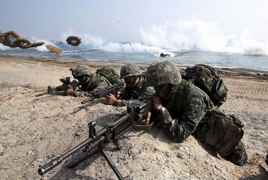 South Korean marines participate in a U.S.-South Korea joint landing operation drill as Amphibious assault vehicles of the South Korean Marine Corps throw smoke bombs in Pohang March 30, 2015. The drill is part of the two countries' annual military training called Foal Eagle, which runs from March 2 to April 24.