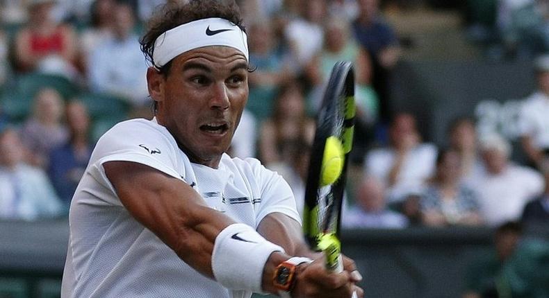 Spain's Rafael Nadal returns against US player Donald Young during their men's singles second round match on the third day of the 2017 Wimbledon Championships July 5, 2017