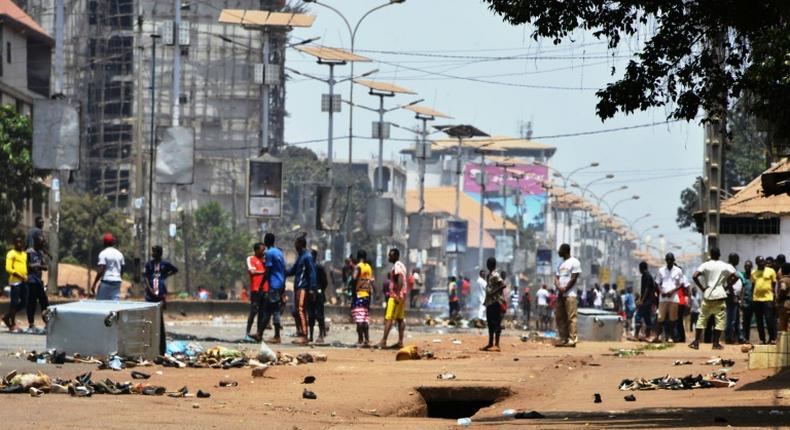 Protesters confront the Guinean army in the streets in Conakry on March 22, 2020, during a constitutional referendum in the country