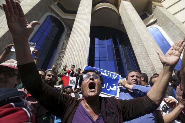 Egyptian activists shout slogans against President Abdel Fattah al-Sisi and his government, during a