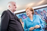 ngela Merkel (Christian Democratic Union - CDU) speaks with interior minister Horst Seehofe