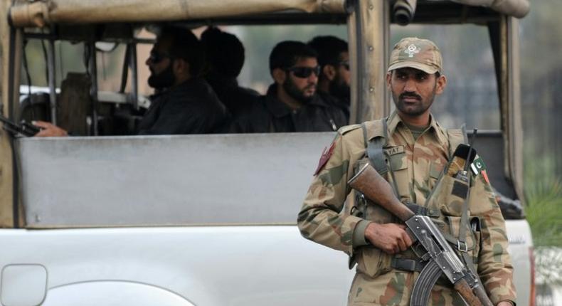 A Pakistani army soldier stands guard at a checkpoint in the garrison city of Rawalpindi on December 5, 2009