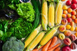 flat lay of different summer fruits, vegetables, greens and berries