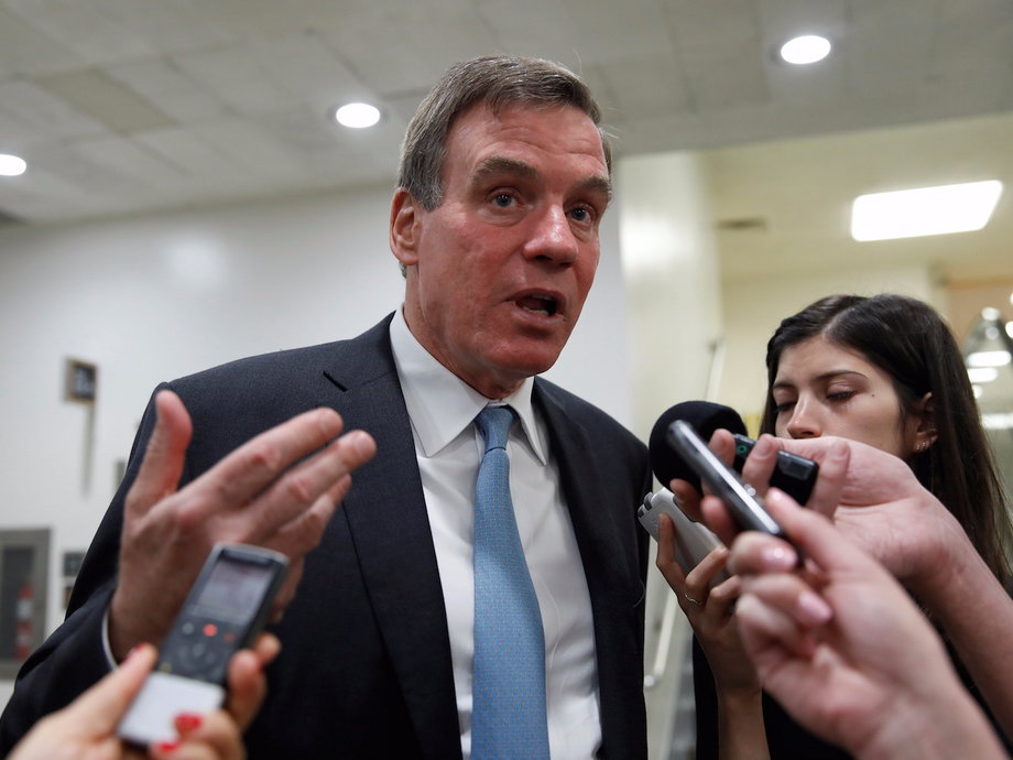 Sen. Mark Warner (D-VA) speaks with reporters.