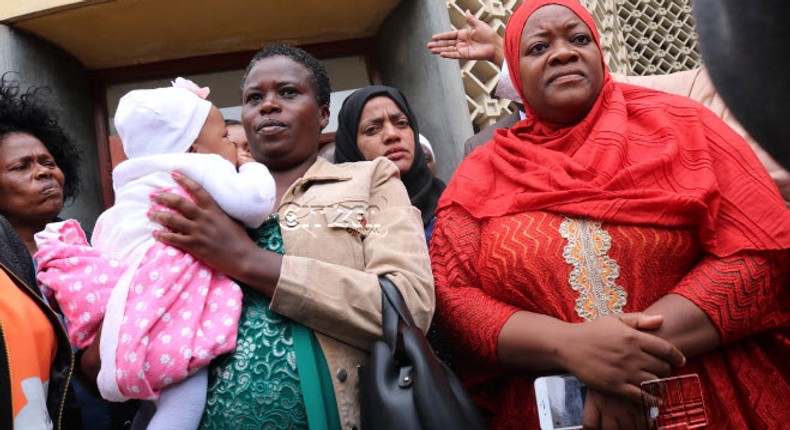 Kwale Woman Rep Zulekha Hassan in red outside Parliament building. (Citizen)