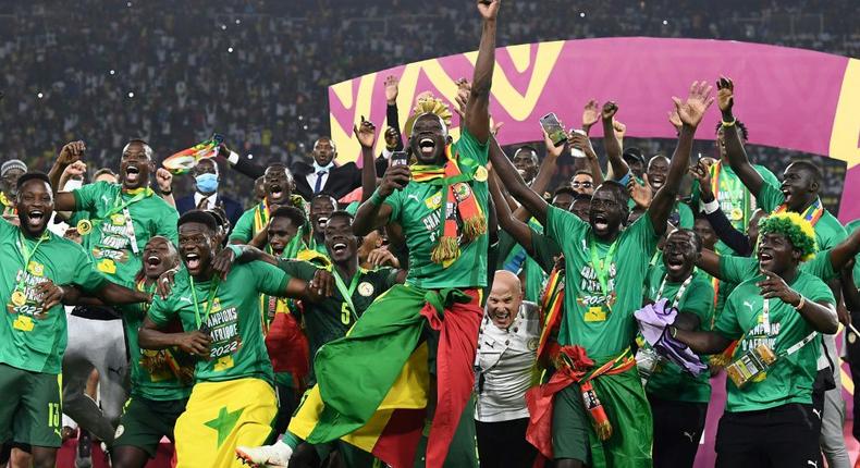 Senegal celebrate with the trophy after winning their first Africa Cup of Nations title Creator: CHARLY TRIBALLEAU