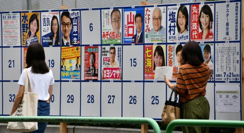 Prime Minister Shinzo Abe's ruling coalition is forecast to win a solid majority