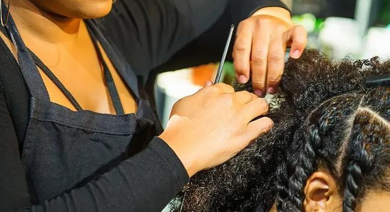 A woman being braided