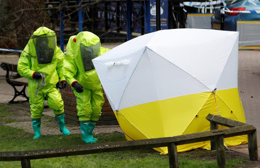 Police officers continue to guard the scene where a forensic tent, covering the bench where Sergei S