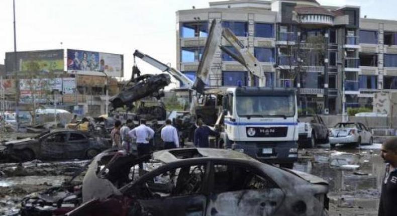 Suicide car bomber kills at least 14 north of Baghdad - police