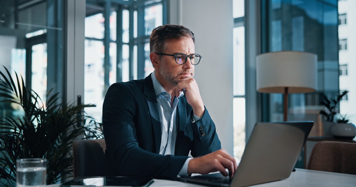 Business,,Thinking,And,Man,With,Laptop,,Online,Reading,And,Internet