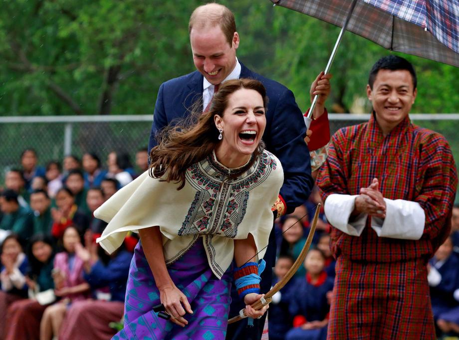 Britain's Catherine, Duchess of Cambridge reacts after shooting an arrow at Changlimithang Archery G