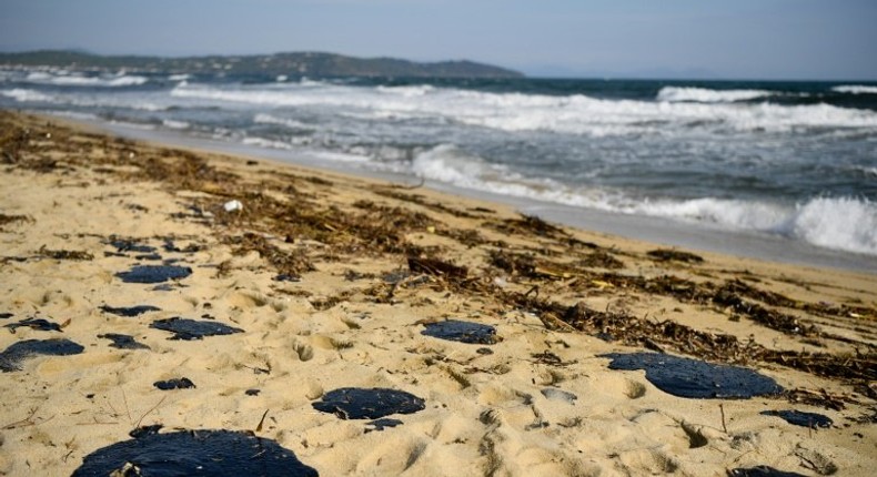 Pools of tar fester on the sand of Pampelone beach in Ramatuelle, in the Gulf of Saint-Tropez