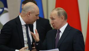 Anton Siluanov (left) is finance minister in the government of Russian President Vladimir Putin (right).