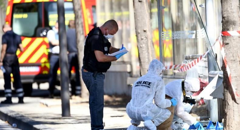 French police search through debris after a van ploughed through a bus stop in Marseille, on August 21, 2017