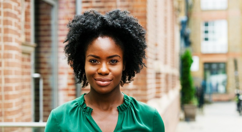 woman in green feeling confident