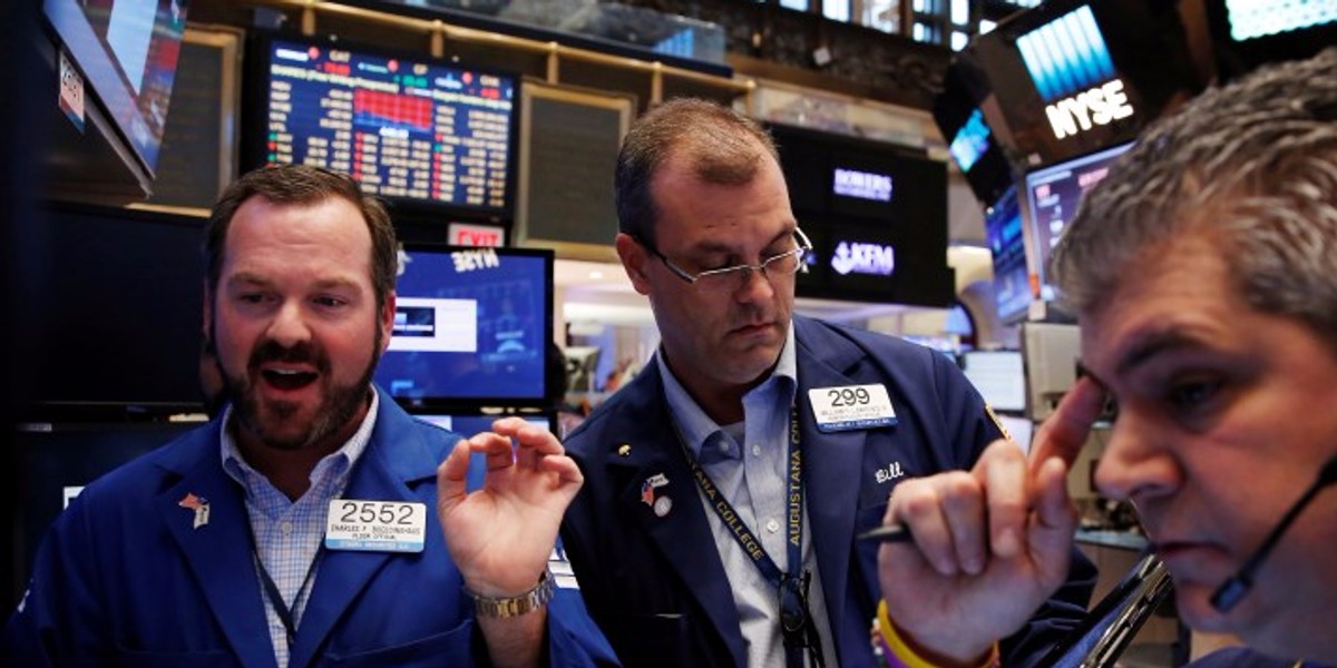 Traders work on the floor of the New York Stock Exchange (NYSE) in New York