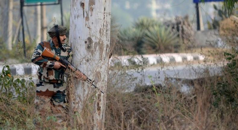 An Indian soldier stands guard during a gun battle with armed militants at an Indian army base at Nagrota, some 15 kms from Jammu on November 29, 2016